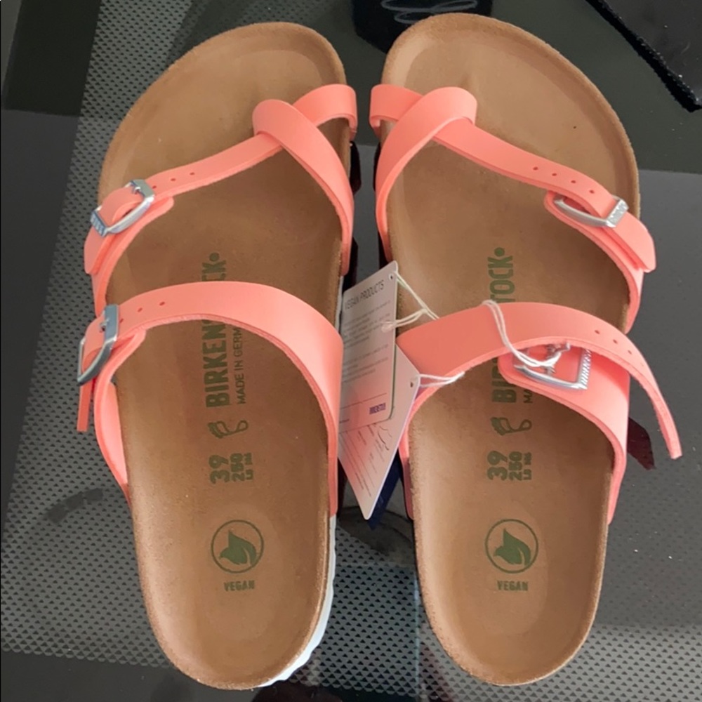 Bright coral Birkenstock’s size 39